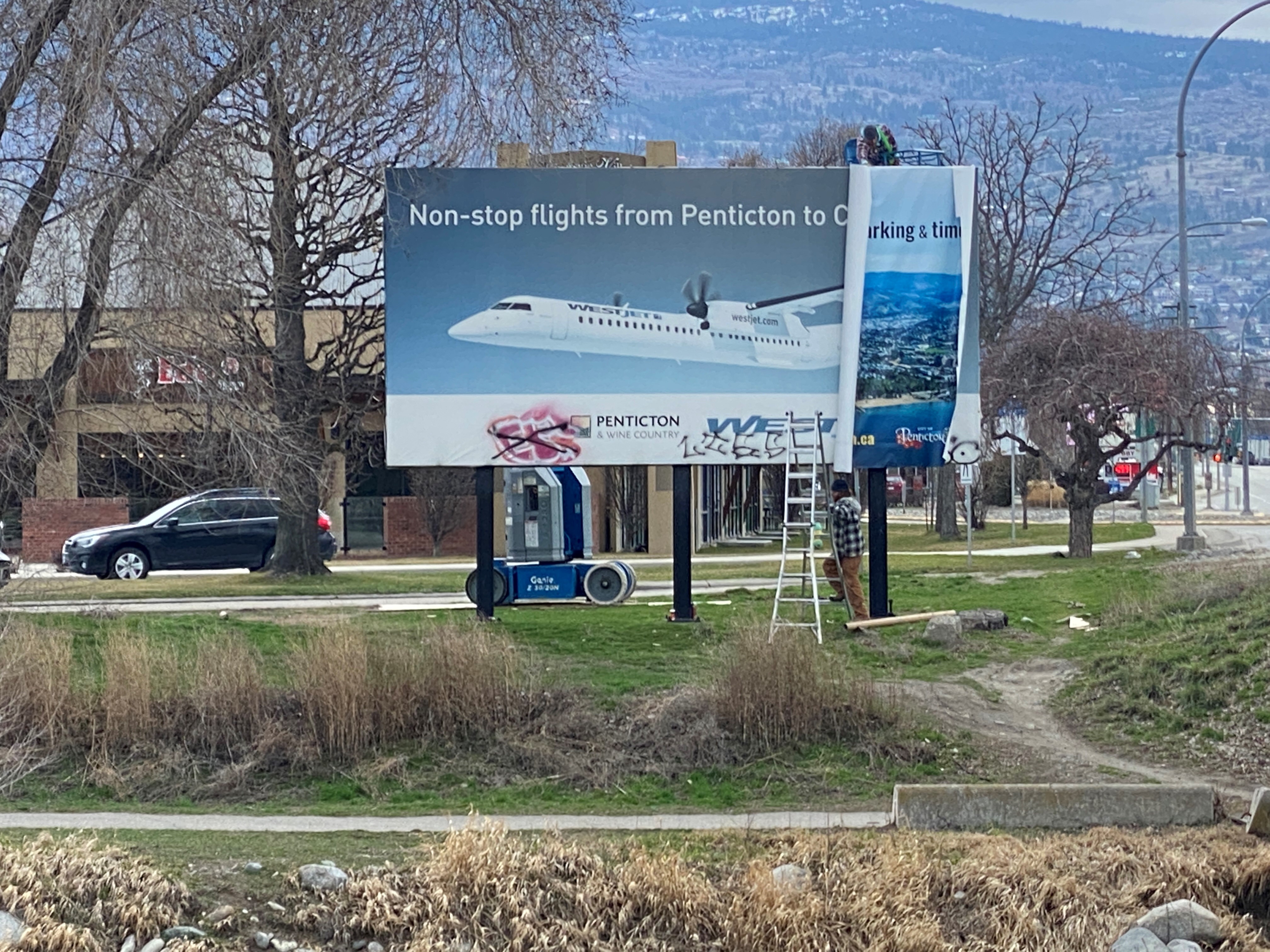 New Penticton Airport billboard being mounted